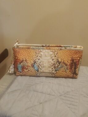 Brahmin Kayla Yellow Multi-Color Snake-Embossed Wristlet Clutch with tassel.